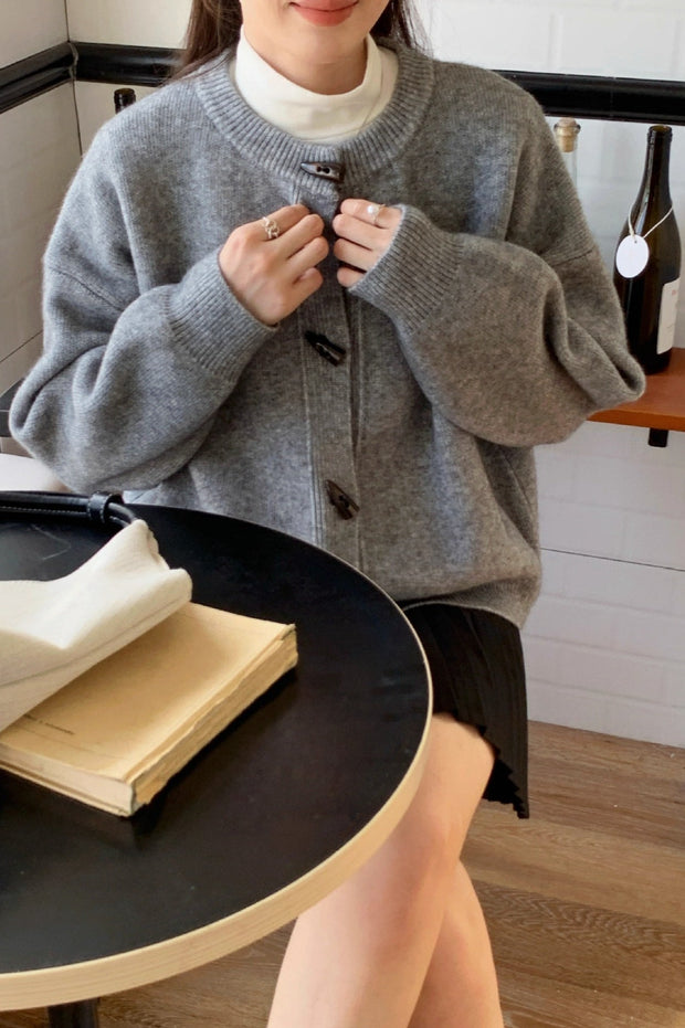 Locker geschnittene Strickjacke mit Knopfdetails und Strickstruktur in Gelb