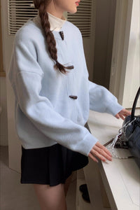 Locker geschnittene Strickjacke mit Knopfdetails und Strickstruktur in Gelb