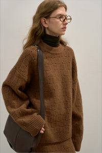 Locker geschnittener Pullover mit Rundhalsausschnitt, Strickstruktur und Wolle